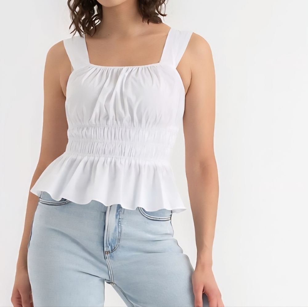 Ricki's White Sleeveless Peplum Top. Size US XL